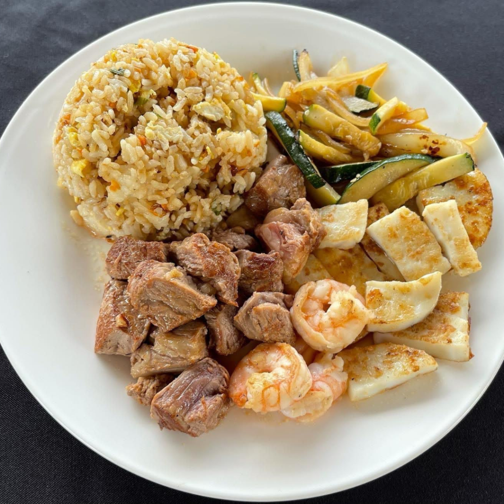 Hibachi style filet mignon and calamari with fried rice